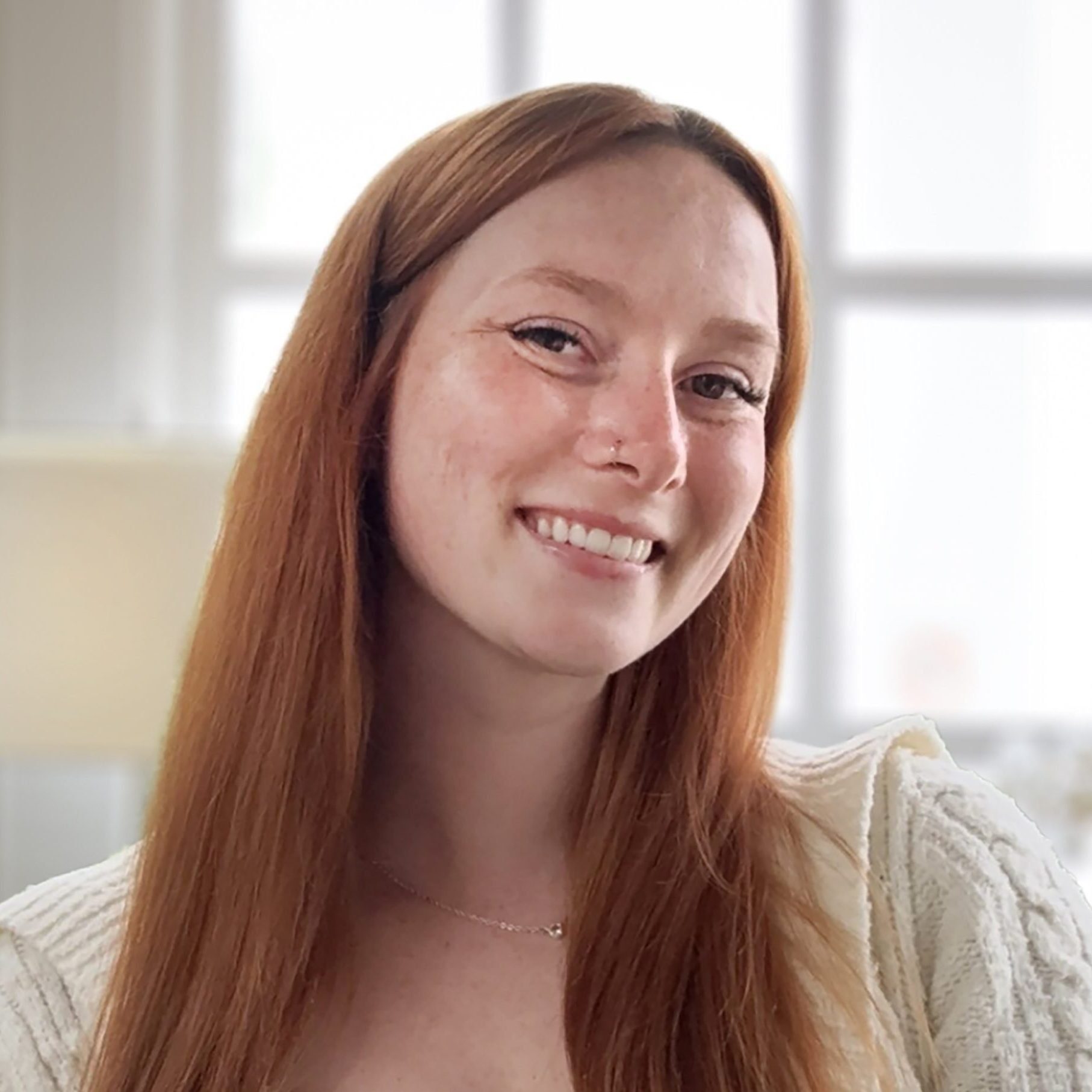 Ellie Lynn, MSW, LSW, smiling therapist at Holistic Consultation's Columbus, Ohio location