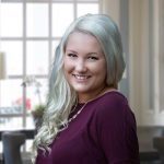 Hannah Lindh, MSW, LSW, smiling queer and gender-affirming therapist at Holistic Consultation's Clintonville, Columbus, Ohio location
