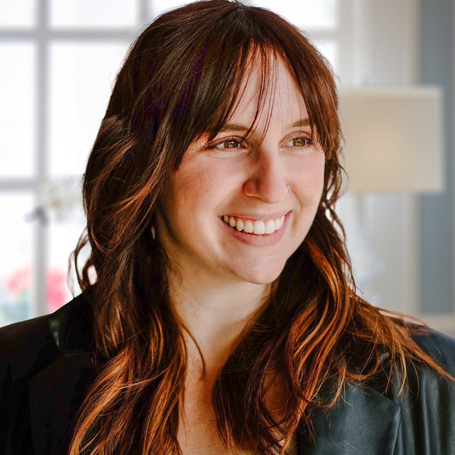 Gabby Veri, LPC, smiling therapist for kids, teens, and adults in Columbus, Ohio and telehealth across Ohio