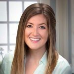 Kimberly Grenier, MA, LPCC, smiling telehealth therapist serving clients across Ohio, specializing in trauma and attachment-focused care