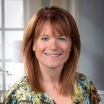 Traci Davison, Billing Manager at Holistic Consultation, smiling in professional headshot